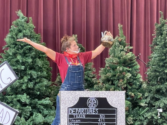 Mackenzie Laminack, worship leader for Humphreys Vacation Bible School, performs the welcome skit for day one of VBS,  Aug. 9, at the Four Chaplains Memorial Chapel.  (Photo by Monica K. Guthrie)