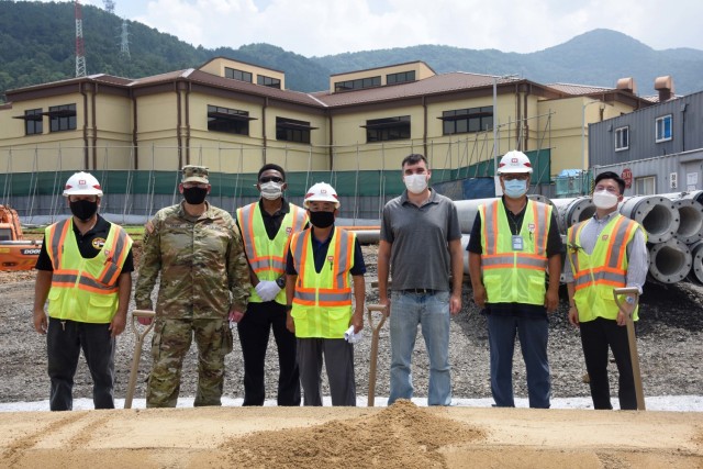 Col. Christopher Crary, U.S. Army Corps of Engineers Far East District commander, and the entire construction team pose for a picture after the groundbreaking ceremony for the Camp Walker Lodge, Aug. 11. (U.S. Army photo)