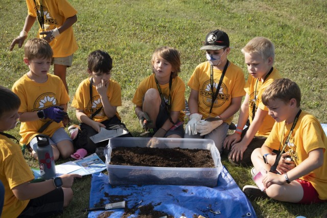 Marcos Ramirez (third from right), a student in STEM Kamp, expressed his interest in paleontology while learning about archeology on Aug. 5 at the Chena River Lakes Flood Control Project near North Pole, Alaska. The U.S. Army Corps of Engineers...