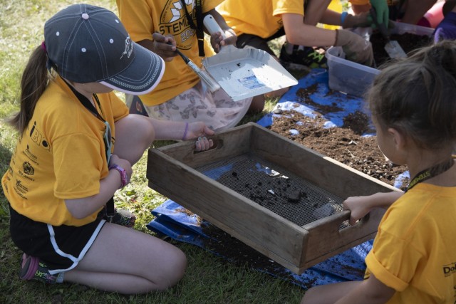 Students work together to sift soil during an archeology demonstration on Aug. 5 at the Chena River Lakes Flood Control Project near North Pole, Alaska. Kelly Eldridge, archeologist with the U.S. Army Corps of Engineers – Alaska District,...
