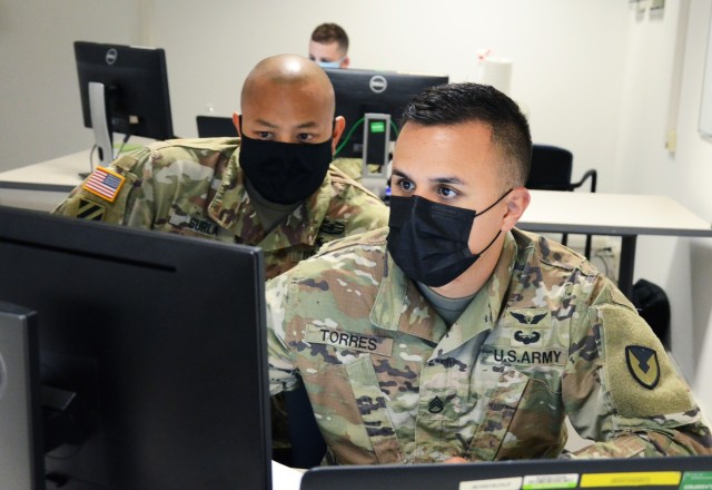 VICENZA, Italy (Aug. 10, 2021) – 414th Contracting Support Brigade Sgt. First Class Justino Surla, left, and Staff Sgt. Luis Torres go over a contracting action during the evaluation exercise Aug. 10.
...