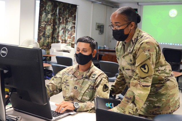 VICENZA, Italy (Aug. 10, 2021) – 414th Contracting Support Brigade Capt. Rene Polit, left, provides a Mission Status Update to Command Sgt. Maj. Rachel Harris, 414th CSB, during the evaluation exercise supported by the Mission and Installation...