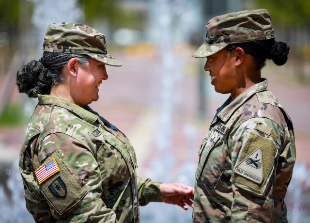 Maj. Eloisa Cox, brigade logistics officer, 3rd Armored Brigade Combat Team, 1st Armored Division shares a moment with her daughter, Spc. Ayana Anthony, a combat medic assigned to Charlie Company, 123rd Brigade Support Battalion, 3rd ABCT her while forward deployed to the Republic of Korea.