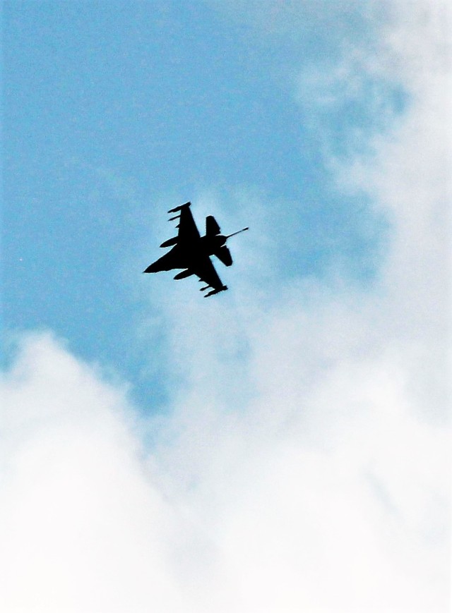 An Air Force F-16 Fighting Falcon flies over Fort McCoy, Wis., on Aug. 9, 2021. The fighter jet was participating in the Northern Lightning 2021 exercise at nearby Volk Field, Wis. Volk Field Combat Readiness Training Center was hosting...