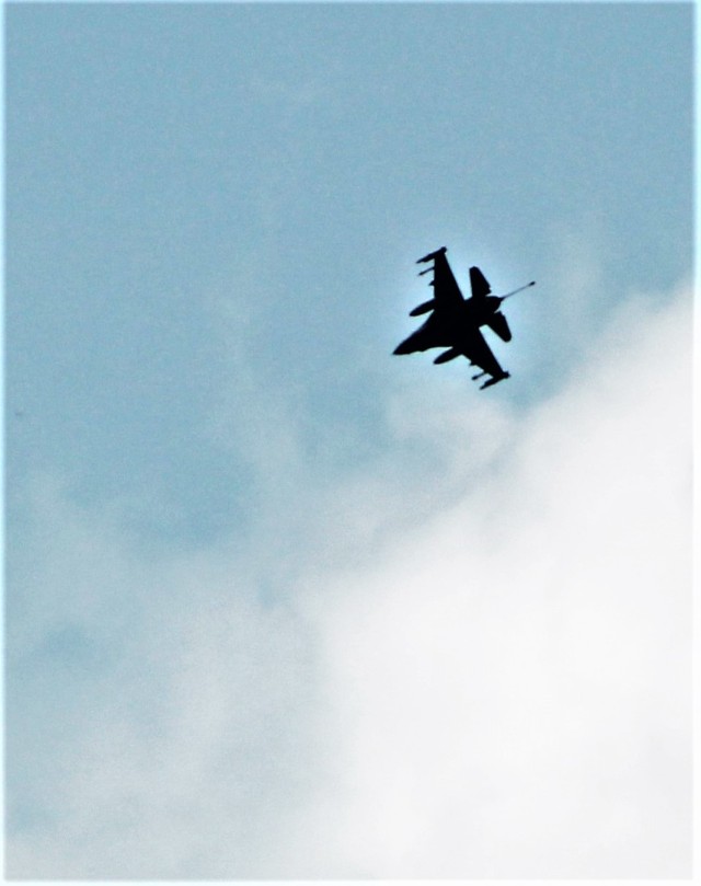 An Air Force F-16 Fighting Falcon flies over Fort McCoy, Wis., on Aug. 9, 2021. The fighter jet was participating in the Northern Lightning 2021 exercise at nearby Volk Field, Wis. Volk Field Combat Readiness Training Center was hosting...