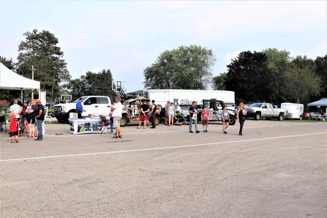 Personnel with the Fort McCoy (Wis.) Directorate of Emergency Services are shown Aug. 3, 2021, at Winnebago Park in Tomah, Wis., for the Monroe County National Night Out. Hundreds of people attended the event, which was held at Tomah’s Winnebago...