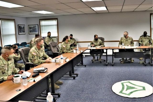 The 40th Chief of Staff of the U.S. Army Gen. James McConville (left) and other distinguished visitors listen as Fort McCoy Garrison Commander Col. Michael Poss gives a briefing Aug. 11, 2021, about the installation at the Fort McCoy (Wis.)...