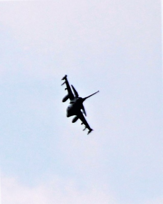 An Air Force F-16 Fighting Falcon flies over Fort McCoy, Wis., on Aug. 9, 2021. The fighter jet was participating in the Northern Lightning 2021 exercise at nearby Volk Field, Wis. Volk Field Combat Readiness Training Center was hosting...