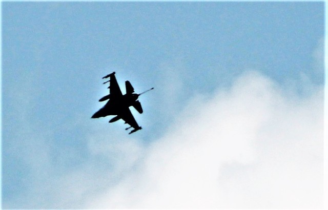 An Air Force F-16 Fighting Falcon flies over Fort McCoy, Wis., on Aug. 9, 2021. The fighter jet was participating in the Northern Lightning 2021 exercise at nearby Volk Field, Wis. Volk Field Combat Readiness Training Center was hosting...