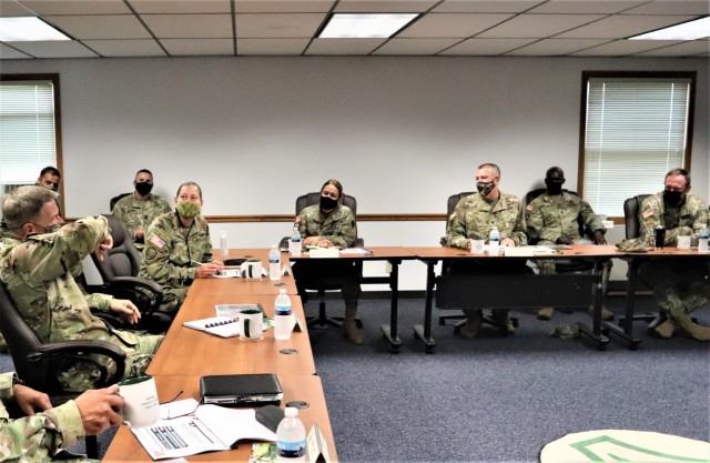 The 40th Chief of Staff of the U.S. Army Gen. James McConville (left) and other distinguished visitors listen as Fort McCoy Garrison Commander Col. Michael Poss gives a briefing Aug. 11, 2021, about the installation at the Fort McCoy (Wis.)...