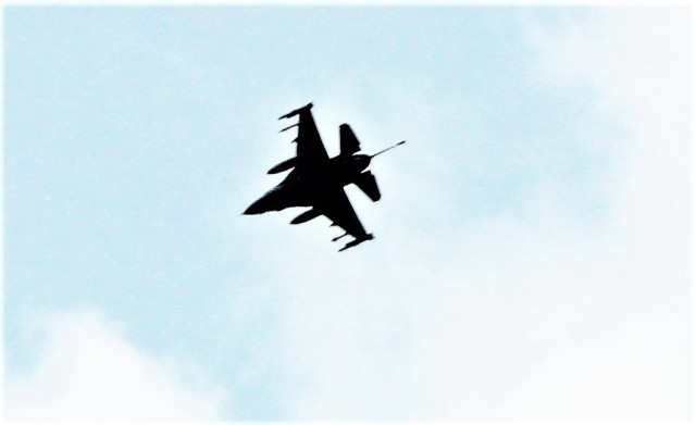 An Air Force F-16 Fighting Falcon flies over Fort McCoy, Wis., on Aug. 9, 2021. The fighter jet was participating in the Northern Lightning 2021 exercise at nearby Volk Field, Wis. Volk Field Combat Readiness Training Center was hosting...