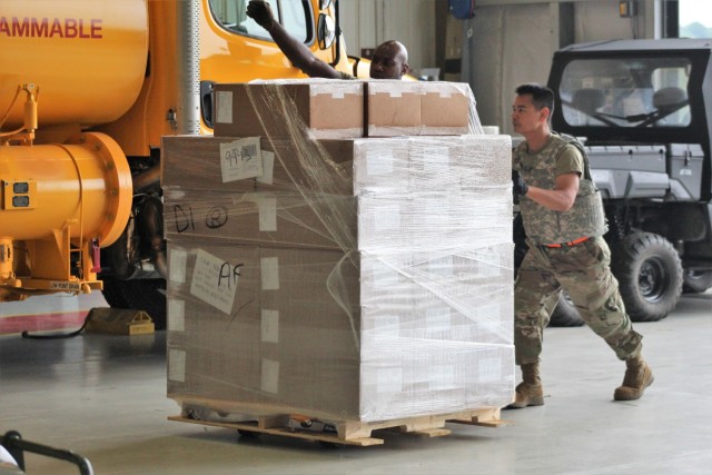 Airmen move cargo Aug. 5, 2021, at the Sparta-Fort McCoy Airport at Fort McCoy, Wis., in preparation for the exercise Patriot Warrior 2021. Patriot Warrior is Air Force Reserve Command's premier exercise, providing an opportunity for Reserve...