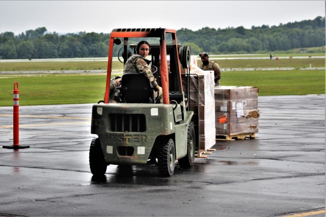 Airmen move cargo Aug. 5, 2021, at the Sparta-Fort McCoy Airport at Fort McCoy, Wis., in preparation for the exercise Patriot Warrior 2021. Patriot Warrior is Air Force Reserve Command's premier exercise, providing an opportunity for Reserve...