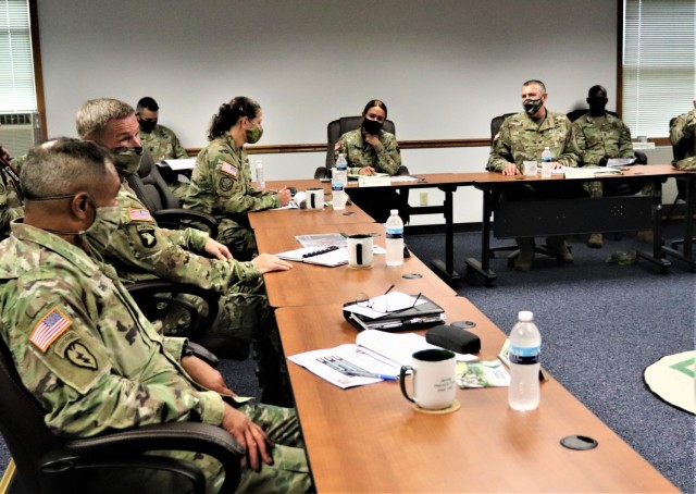 The 40th Chief of Staff of the U.S. Army Gen. James McConville (left) and other distinguished visitors listen as Fort McCoy Garrison Commander Col. Michael Poss gives a briefing Aug. 11, 2021, about the installation at the Fort McCoy (Wis.)...