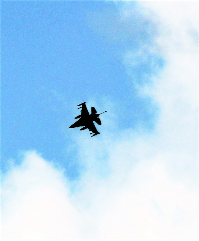 An Air Force F-16 Fighting Falcon flies over Fort McCoy, Wis., on Aug. 9, 2021. The fighter jet was participating in the Northern Lightning 2021 exercise at nearby Volk Field, Wis. Volk Field Combat Readiness Training Center was hosting...