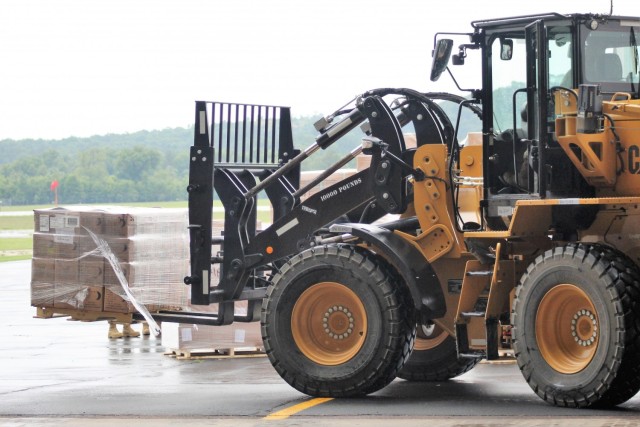 Airmen move cargo Aug. 5, 2021, at the Sparta-Fort McCoy Airport at Fort McCoy, Wis., in preparation for the exercise Patriot Warrior 2021. Patriot Warrior is Air Force Reserve Command's premier exercise, providing an opportunity for Reserve...