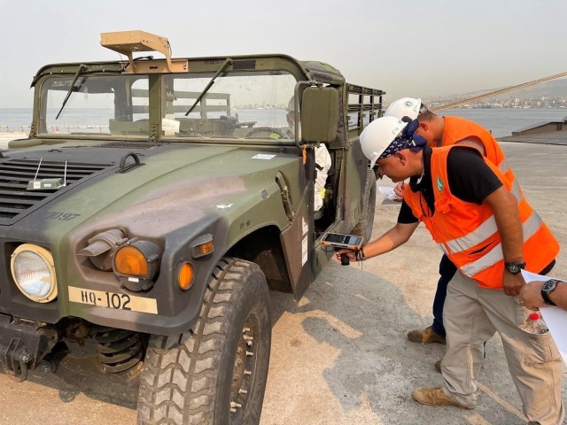 U.S. Army civilians and host-nation transportation professionals from the 839th Transportation Battalion, Black Sea (Turkey) Detachment, oversee the download of Army equipment at the port facility in Izmir, Turkey, August 6, 2021. Following...