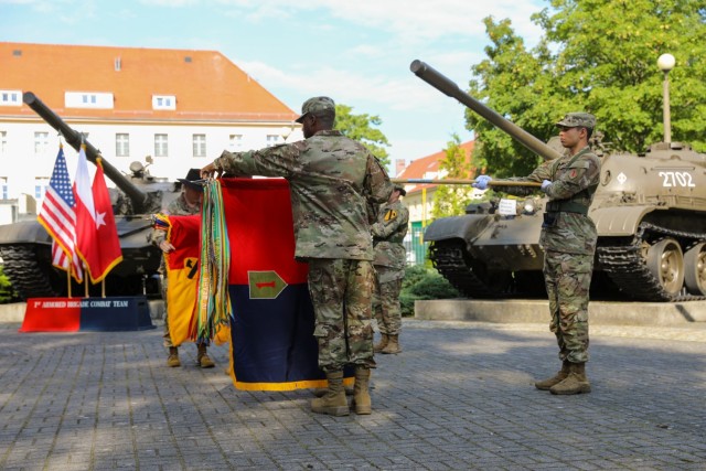 The 1st Armored Brigade Combat Team “Devil Brigade,” 1st Infantry Division Commander Col. Brian McCarthy and Command Sgt. Maj. LeVares Jackson uncase their colors during a transfer of authority in Żagań, Poland, August 13, 2021. Uncasing the colors signifies the transfer of authority from 1ABCT, 1st Cavalry Division is complete, and that 1ABCT, 1ID is operational and ready to perform its mission in support of Atlantic Resolve. There are three types of Atlantic Resolve rotations – armored, aviation, and sustainment task force. 