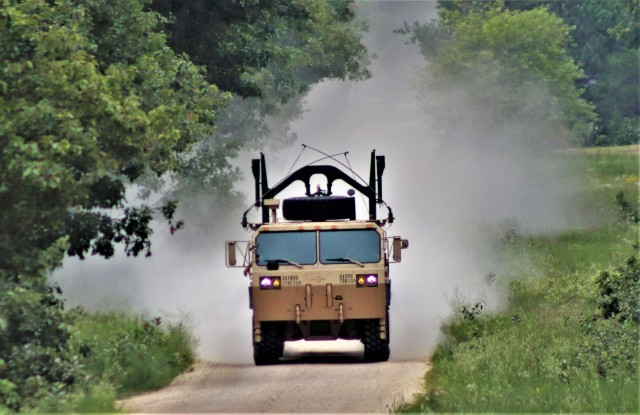 Soldiers at Fort McCoy, Wis., for training in the mobilization exercise Pershing Strike ’21 conduct operations July 22, 2021, at Fort McCoy, Wis. During the exercise, troops were able to access and use the Mission Command Configuration Center as...