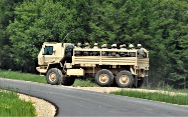Soldiers at Fort McCoy, Wis., for training in the mobilization exercise Pershing Strike ’21 conduct operations July 22, 2021, at Fort McCoy, Wis. During the exercise, troops were able to access and use the Mission Command Configuration Center as...
