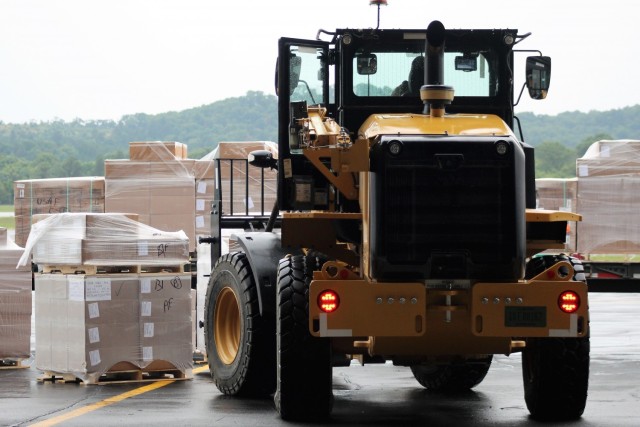 Airmen move cargo Aug. 5, 2021, at the Sparta-Fort McCoy Airport at Fort McCoy, Wis., in preparation for the exercise Patriot Warrior 2021. Patriot Warrior is Air Force Reserve Command's premier exercise, providing an opportunity for Reserve...