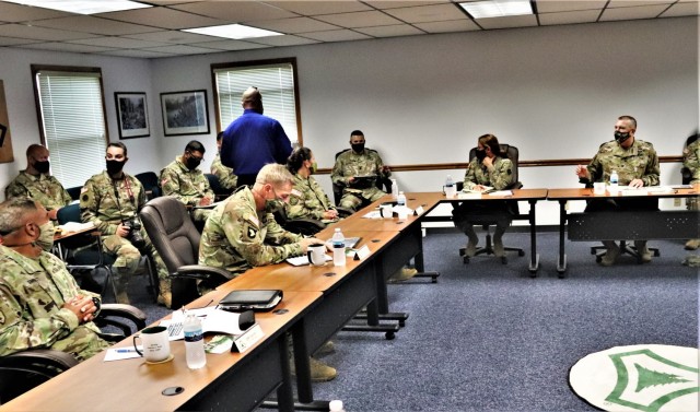 The 40th Chief of Staff of the U.S. Army Gen. James McConville (left) and other distinguished visitors listen as Fort McCoy Garrison Commander Col. Michael Poss gives a briefing Aug. 11, 2021, about the installation at the Fort McCoy (Wis.)...