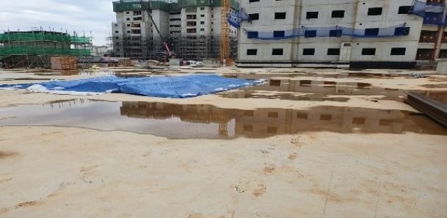 FED personnel secure loose materials at the Army Family Housing Tower AFH100 project site, to prepare for an incoming typhoon on USAG Humphreys, Sept. 2, 2020. The FED typhoon construction checklist focuses on storm water pollution prevention,...