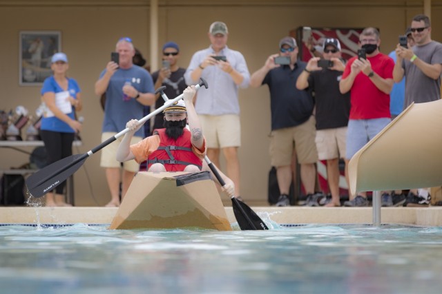 Competitors take to the water in the Soldier/adult division of the Cardboard Regatta at Fort Bliss, Texas, Aug. 14, 2021. Bliss Family and Morale, Welfare and Recreation held the annual event, which challenged contestants to build two-person...