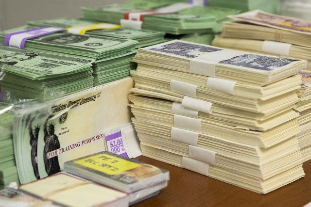 Exercise props, including play currency, EagleCash cards and mock Treasury checks, sit ready for use during Diamond Saber at Fort McCoy, Wisconsin, Aug. 14, 2021. Diamond Saber is a U.S. Army Reserve-led exercise that incorporates participation...