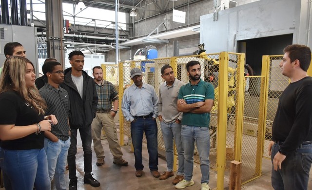 Interns with the Minority College Relations Program tour the Quad City Cartridge Case Facility for an in-person lesson on production lines. Note: photos were taken before DoD reinstated mandate to wear masks on federal installations. 