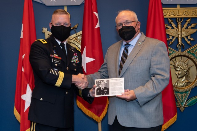 Retired Lt. Gen. Richard Formica, right, receives his honorary plaque from Brig. Gen. Michael McCurry, director of force development, G-8, after being inducted into the Force Management Hall of Fame at the Pentagon in Washington, D.C., Aug. 16, 2021.  