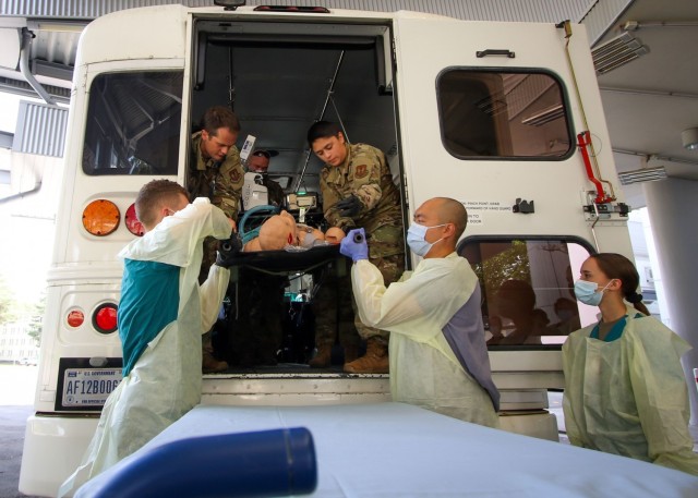 Cadet Lawrence Randall (left), a native of Wylie, Texas, and student at Stephen F. Austin State University at Nacogdoches, Texas, and Cadet Joelle Perry (far right), a Fairfax, Virginia native and student at James Madison University in Harrisonburg, Virginia, respond to a simulated casualty during a training exercise at the Intensive Care Unit at Landstuhl Regional Medical Center, Aug. 12.