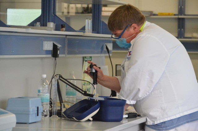 An Army and Air Force Exchange Service employee tests a sample of water at the AAFES water and ice plant at Gruenstadt, Germany, Aug. 6, 2021. The laboratory at Gruenstadt tests the water and bakery items daily to ensure quality and safety.