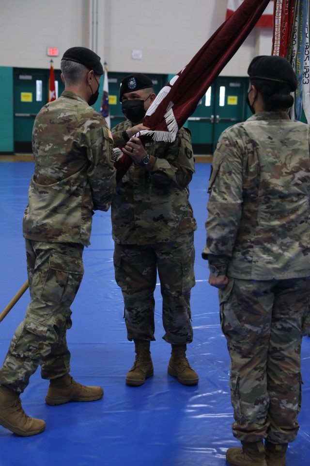 Col. Jeffery L. Reibestein the commander of the 16th Field Hospital, passes the unit’s colors to Lt. Col. Edgardo Ramirez the 14th Field Hospital commander, held at Newman Gym on Fort Stewart, Georgia, Aug 17. The passing of the unit colors...