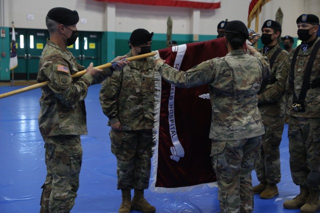 Soldiers assigned to the 14th Field Hospital uncase their unit’s colors during the activation and assumption to command ceremony to activate the 14th FH held at Newman Gym on Fort Stewart, Georgia, Aug 17. The 14th FH mission is to provide...