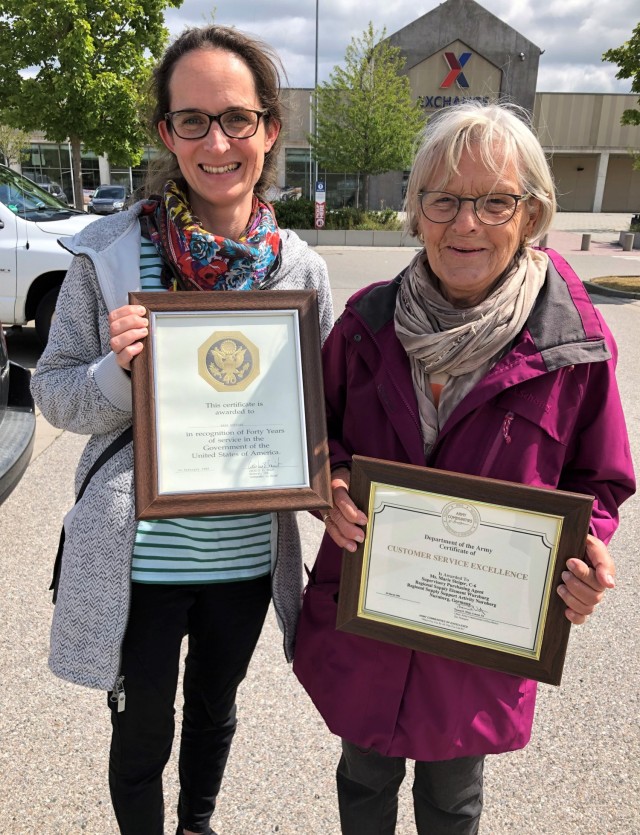 Marie Steiger (right), a former local national employee of the U.S. Forces in Fürth, Germany, and her granddaughter, Nina Scheuerlein, show off some of Steiger’s certificates during a visit on Urlas Kaserne, Aug. 17, 2021.