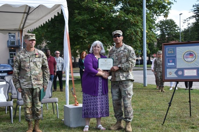 Col. Mario Washington, Wiesbaden Garrison Commander, presented Gwyn Truchon a certificate of appreciation prior to the Garrison Change of Responsibility ceremony Aug. 20 at Clay Kaserne.