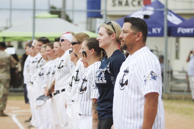 The Navy Women’s Softball Team lines up Aug. 13 before the final Armed Forces Women’s Softball Championship tournament game to compete against Air Force at the South Softball Complex. The Navy ended the game with 20 runs and Air Force finished...