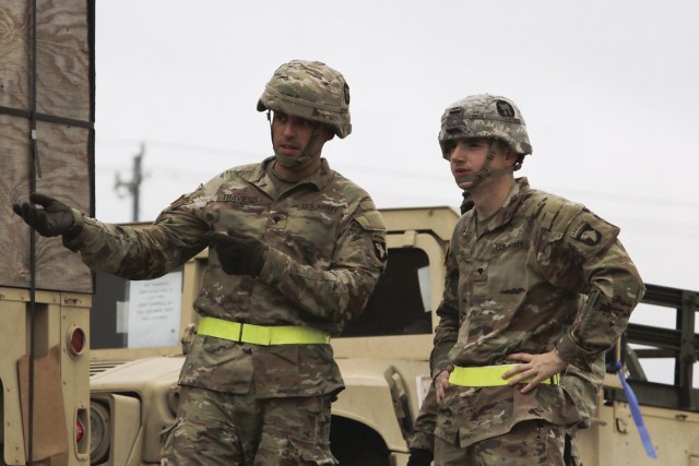 Specialists Luis Travieso, left, and Tanner Amos, both assigned to 3rd Battalion, 320th Field Artillery Regiment, 3rd Brigade Combat Team, 101st Airborne Division (Air Assault), prepare to load equipment Aug. 16 at the Campbell Rail Operations Facility in support of 3rd BCT’s upcoming Joint Readiness Training Exercise rotation at Fort Polk, La.
