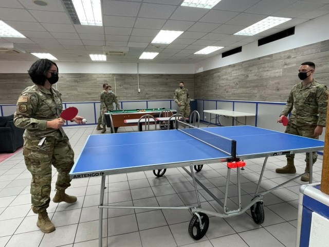 Camp Darby single service members craft their own recreation room