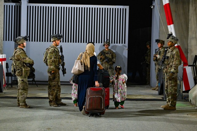 Paratroopers assigned with the 1st Brigade Combat Team, 82nd Airborne Division assist with the safe evacuation of U.S. citizens, Special Immigrant Visa applicants, and other at-risk Afghans from the Hamid Karzai International Airport in Kabul, Afghanistan.