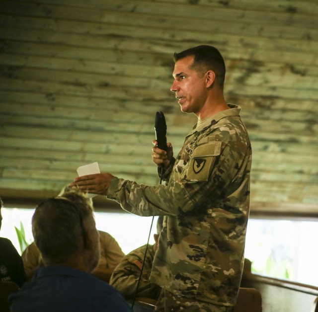 USAG-KA Commander Col. Thomas Pugsley addresses attendees at a garrison town hall for the island's bachelor quarters residents Aug. 12, 2021 at the Island Memorial Chapel.