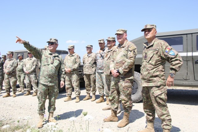 Romanian Military Leaders provide a site tour of Resolute Castle construction projects to 416th Theater Engineer Command Team at the National Joint Training Center in Cincu, Romania in July, 2021.  Capt. Naicea briefs Col. Calin, Maj. Gen. Baker,...
