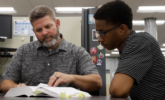 At left, mentor, Jerry Cuppy, Lead Ammunition Technical Specialist at JMC, shares his experience and knowledge with mentee, Charles Harris, a JMC intern. The JMC’s mentorship program is expected to serve as a way to transfer skills, knowledge and organizational culture from experienced to newer employees.