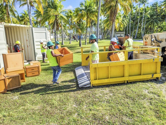 Logistics personnel prepare to deliver furniture donated from U.S. Army Garrison-Kwajalein to Enniburr in a recent joint effort coordinated by the offices of the USAG-KA Republic of the Marshall Islands Liaison and Host Nation Activities. (Courtesy photo by Hilary Hosia)