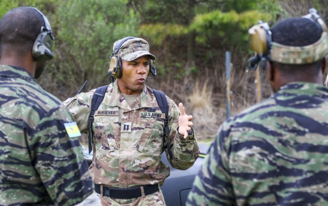 Capt. MJ McKiever provides weapons instruction to role players during a mission readiness exercise at Fort Bragg, N.C.