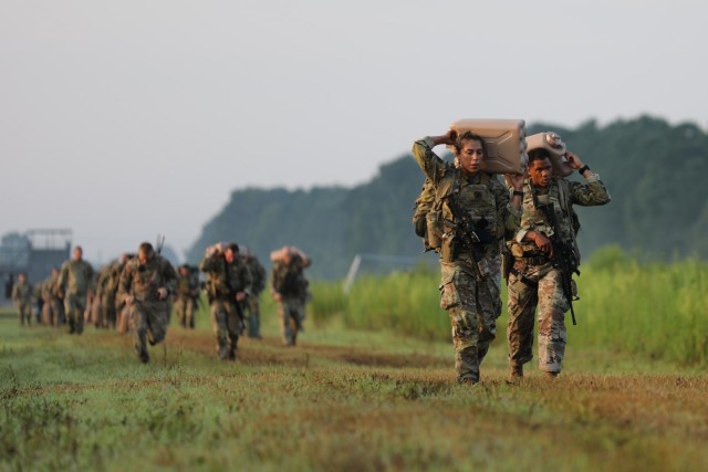 Soldiers from 2nd Security Force Assistance Brigade complete a physical endurance challenge as part of their mission readiness exercise.