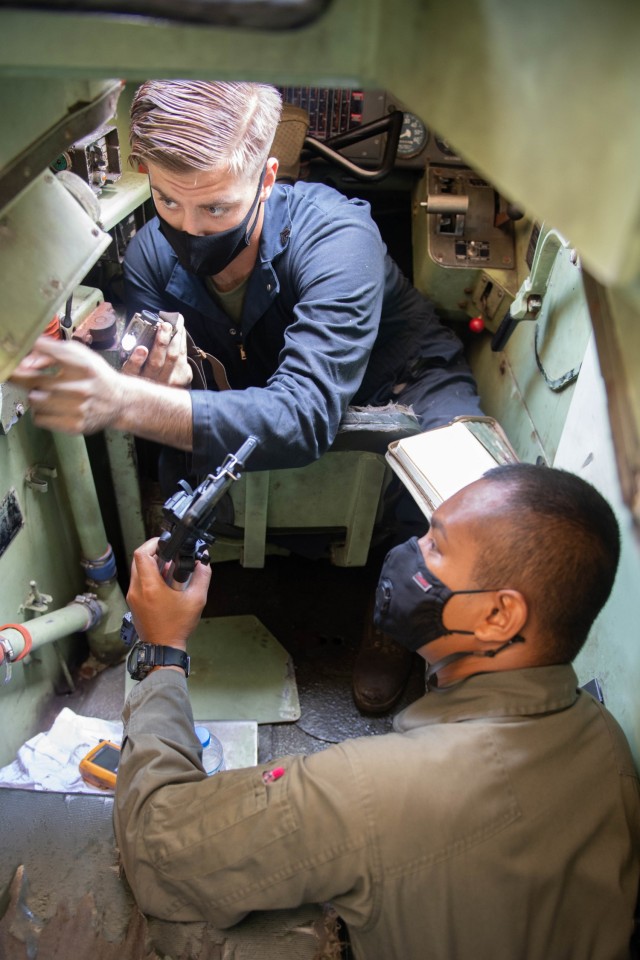 210810-N-UM222-0060 PATTAYA, Thailand (Aug. 10, 2021)- U.S. Marine Cpl. Shane Sonday, 3d Assault Amphibian Battalion and Royal Thai Marine Petty Officer 1st Class Charin Warathan conduct maintenance on a Royal Thai Assault Amphibian Vehicle, as part of Exercise Cobra Gold 21, in Pattaya, Kingdom of Thailand, Aug. 10, 2021. Exercise Cobra Gold, now in its 40th year, is a Thai-U.S. co-sponsored training event that builds on the longstanding friendship between the two allied nations and promotes regional peace and security in support of a free and open Indo-Pacific. (U.S. Navy photo by Mass Communication Specialist 2nd Class Jasmine Suarez)