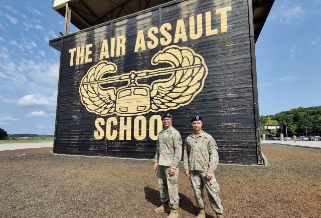 Maj. Mark S. Quint (left) from Nuclear Disablement Team 3 and Capt. Derek D. Whipkey from NDT 1 graduate from the Sabalauski Air Assault School on Fort Campbell, Kentucky, Aug. 10.  Part of the 20th Chemical, Biological, Radiological, Nuclear, Explosives (CBRNE) Command, the NDT officers prepared for the rigorous course at Gunpowder Range in Glen Arm, Maryland.  Courtesy photo.