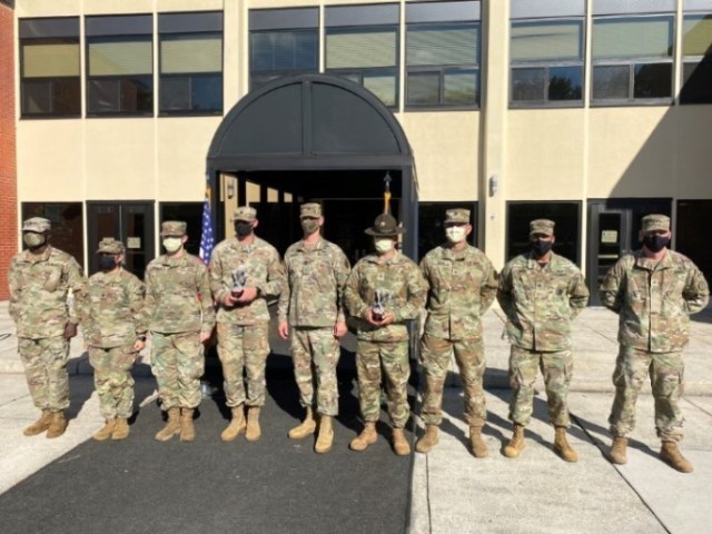 Command Sgt. Maj. Scott Beeson surrounded by Fort Eustis Soldiers who just completed the award ceremony for the NCO and Soldier of the Year Competition.